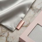 Luminous Radiant Silver Satin Pillowcase with Elegant Draped Detail and Matte Pink Gift Box